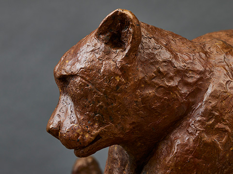 detailed view of a brown bear sculpture highlighting the texture and form ideal for art enthusiasts and wildlife lovers showcasing sculpture techniques 2